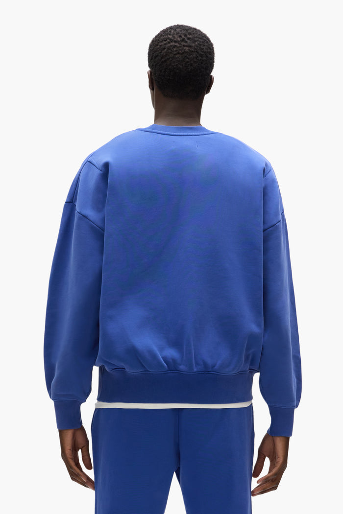 Basic Crewneck Sweater in blue, oversized fit, heavyweight fleece knit, white label.
