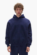 Basic Hoodie in Navy, oversized fit, made of 100% cotton, featuring dropped shoulder design.