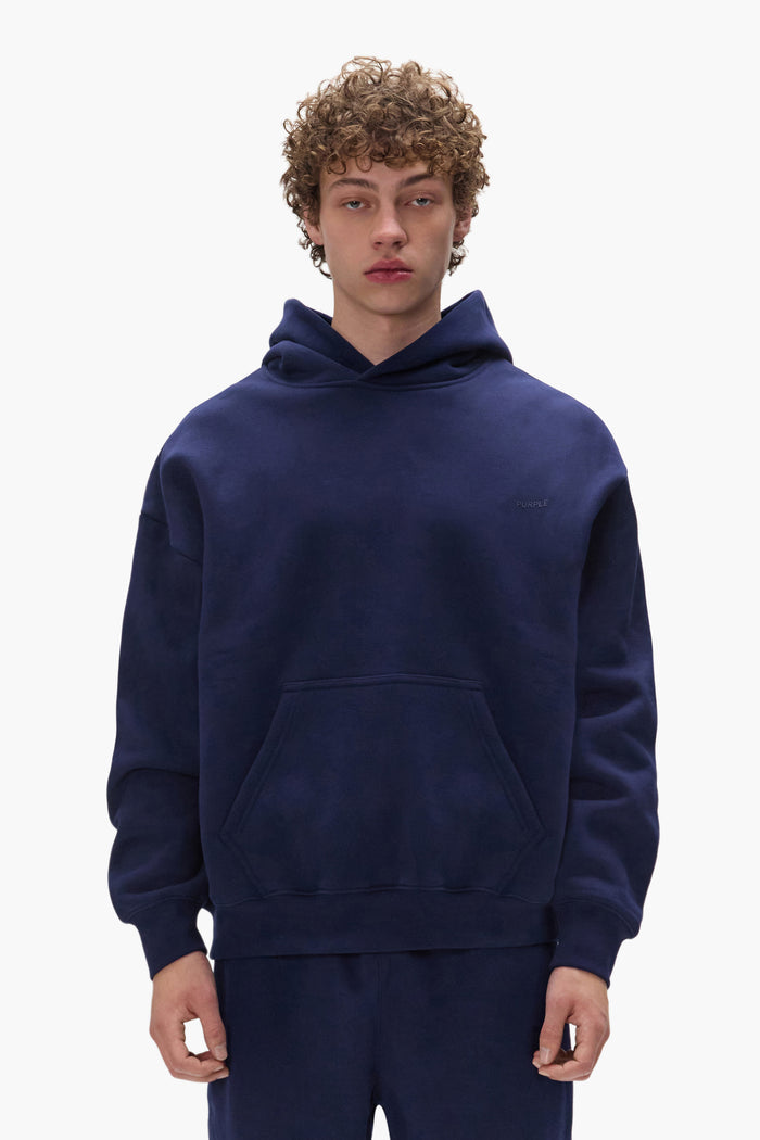 Basic Hoodie in Navy, oversized fit, made of 100% cotton, featuring dropped shoulder design.