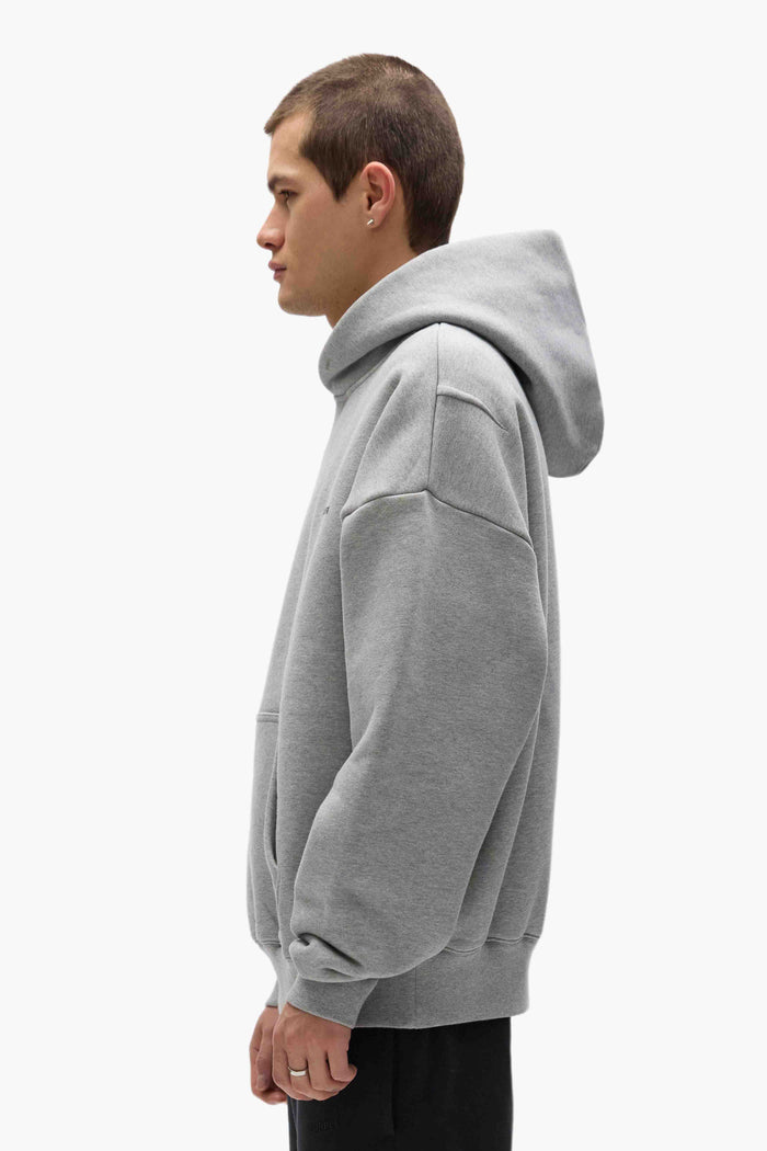 Basic Hoodie in purple, oversized fit with dropped shoulder and Basics logo.