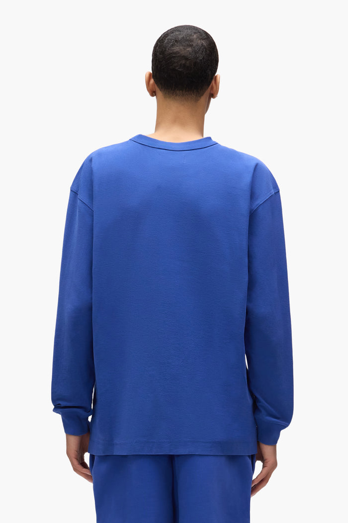 Basic Long Sleeve Tee in blue, made of 100% cotton, with regular fit and textured jersey knit.