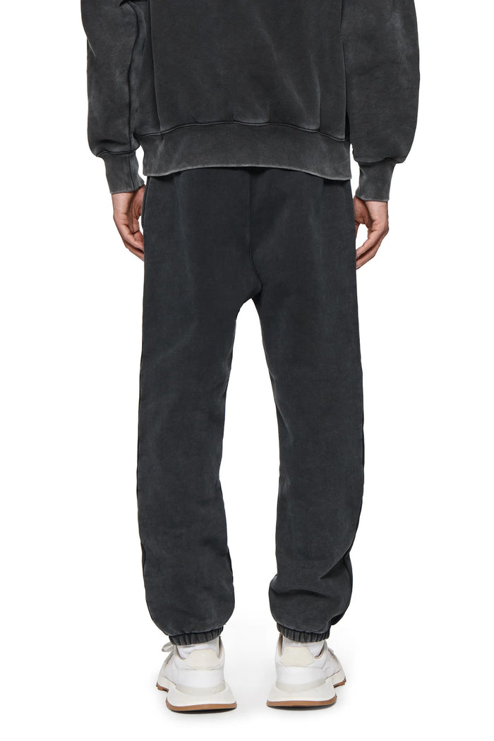 Basic Sweatpant in Washed Black with left thigh screen print and regular fit.