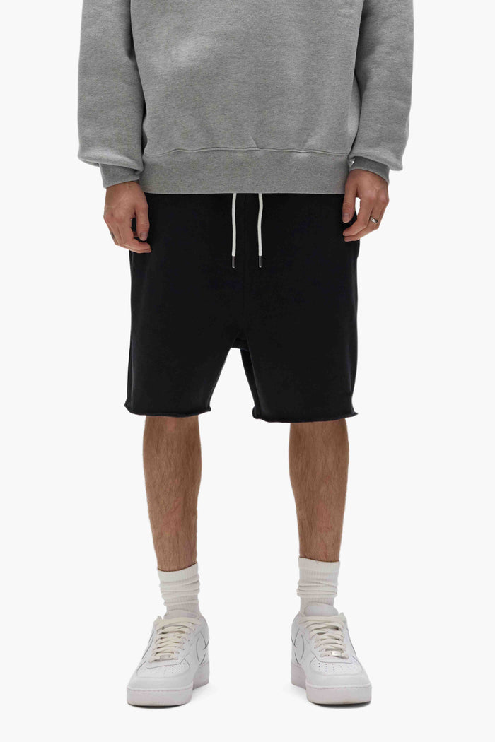 Purple Basic Sweatshort with relaxed fit and raw hem, made of 100% cotton.