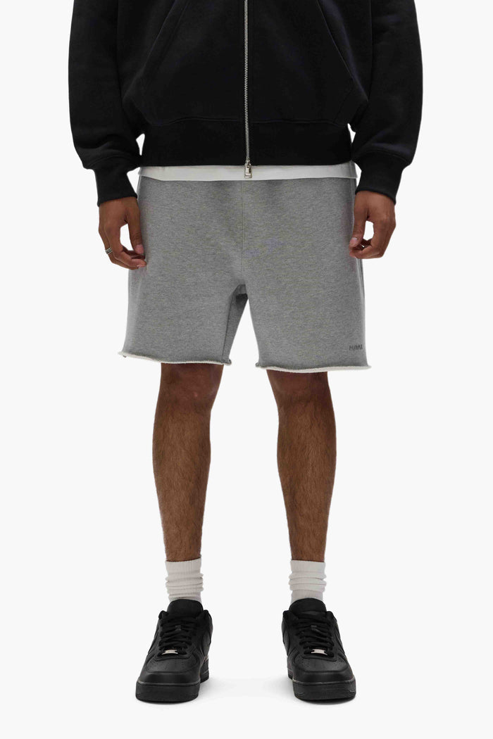 Basic Sweatshort in purple with relaxed fit, raw hem, and heavyweight fleece knit.