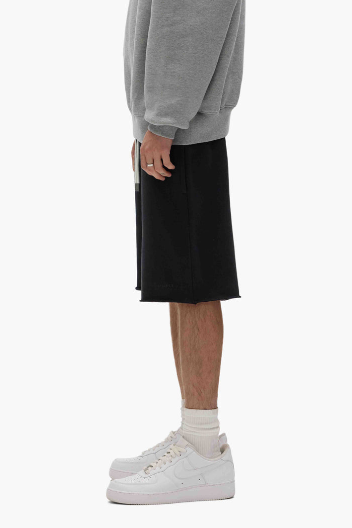 Purple Basic Sweatshort with relaxed fit, 100% cotton, raw hem, and Basics logo.
