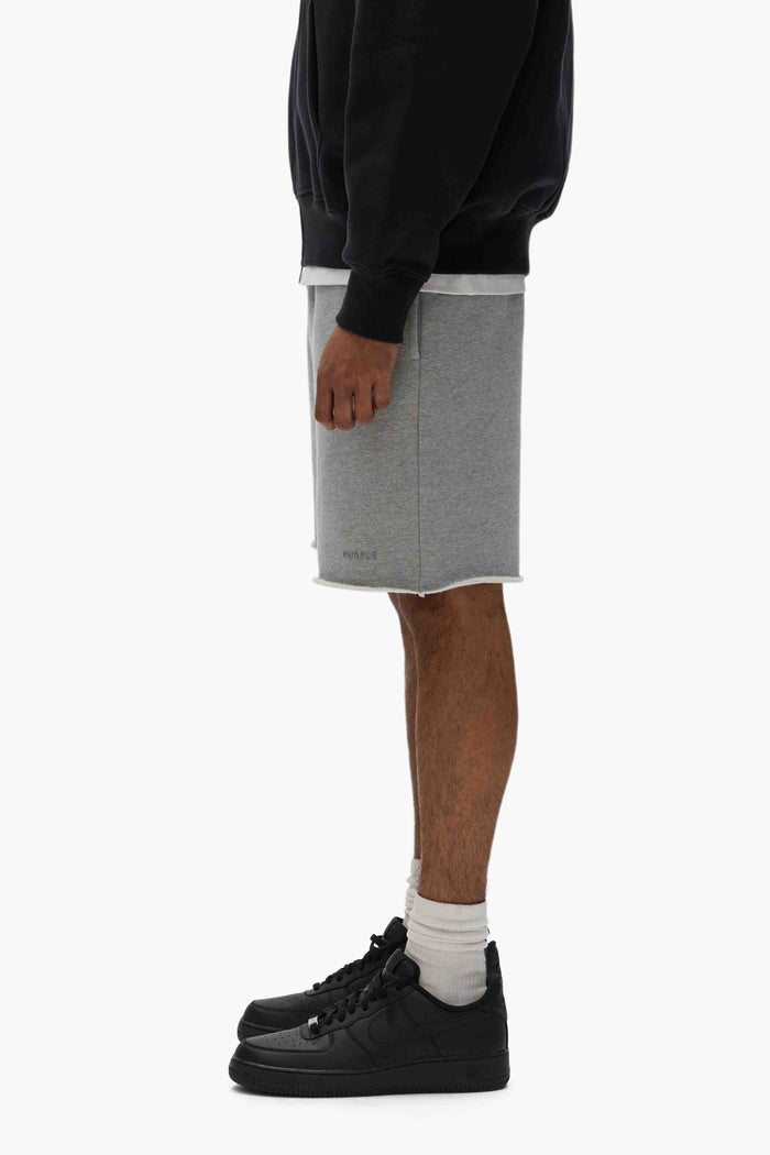 Basic Sweatshort in Purple, relaxed fit, heavyweight fleece knit, raw hem, cotton fabric.