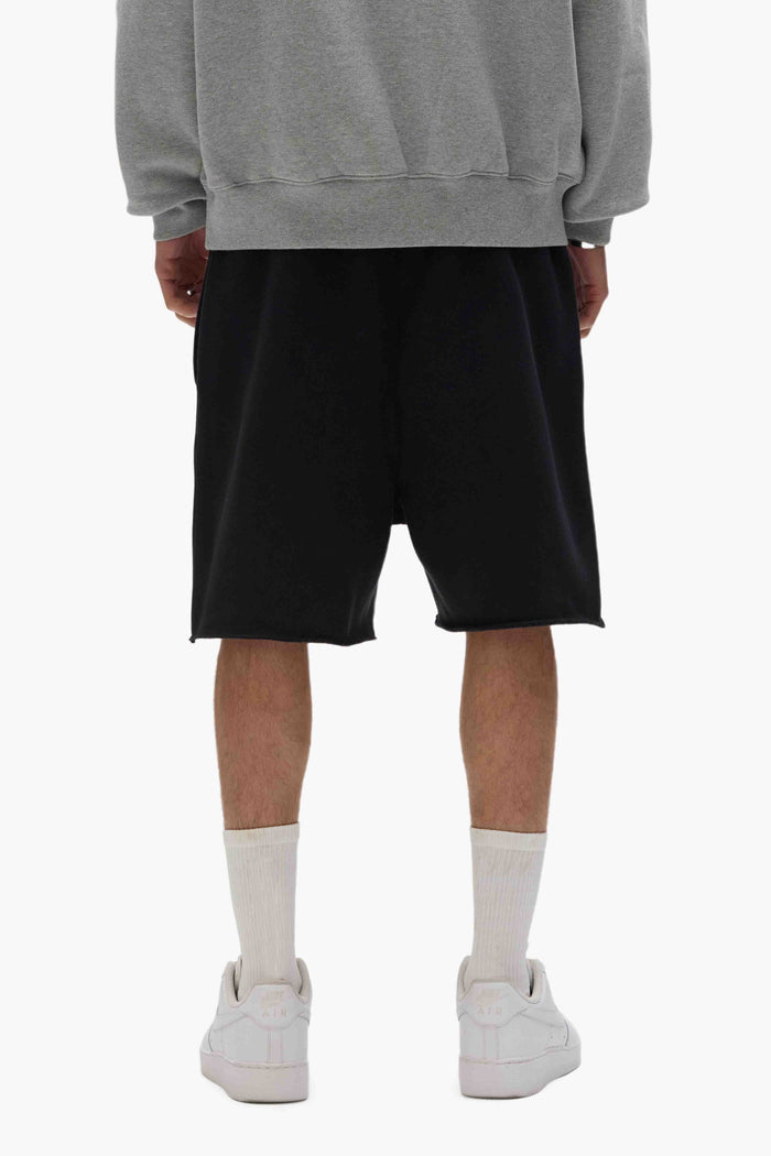 Purple Basic Sweatshorts with relaxed fit and raw hem, 100% cotton fabric.