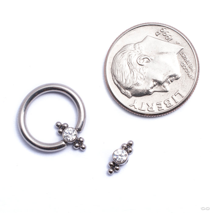 Bezel-set Captive Gem Bead with Double Tri Bead Clusters from LeRoi shown on captive bead ring