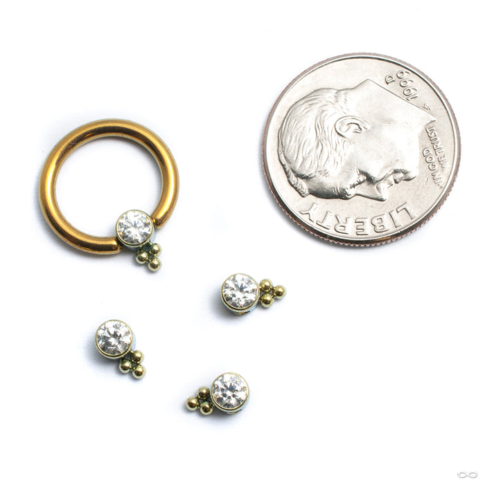 Bezel-set Captive Gem Bead with Tri Bead Cluster from LeRoi with clear cz shown in ring