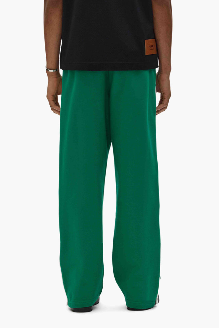 Boston Celtics snap pants with side snaps, elastic waistband, and embroidered details in relaxed fit.