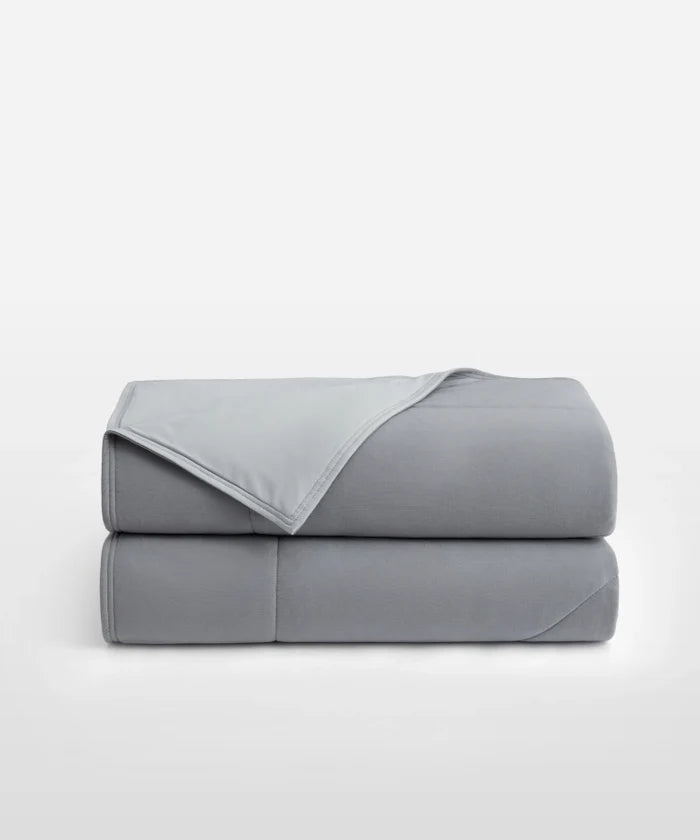 Breescape cooling comforter in misty grey, featuring dual-sided colorblock design for hot sleepers.