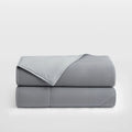 Breescape dual-sided cooling comforter in misty grey colorblock design for hot sleepers.