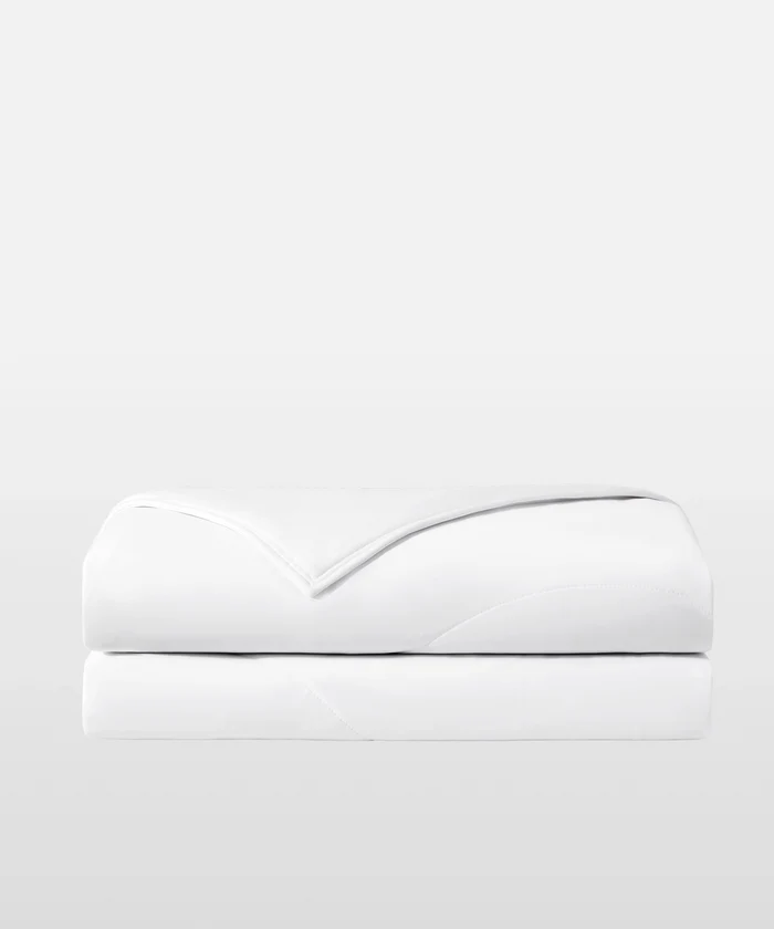 Breescape snow white dual-sided cooling comforter, breathable bedding for hot sleepers.