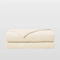 Breescape ivory cooling comforter for night sweats, breathable & folded.