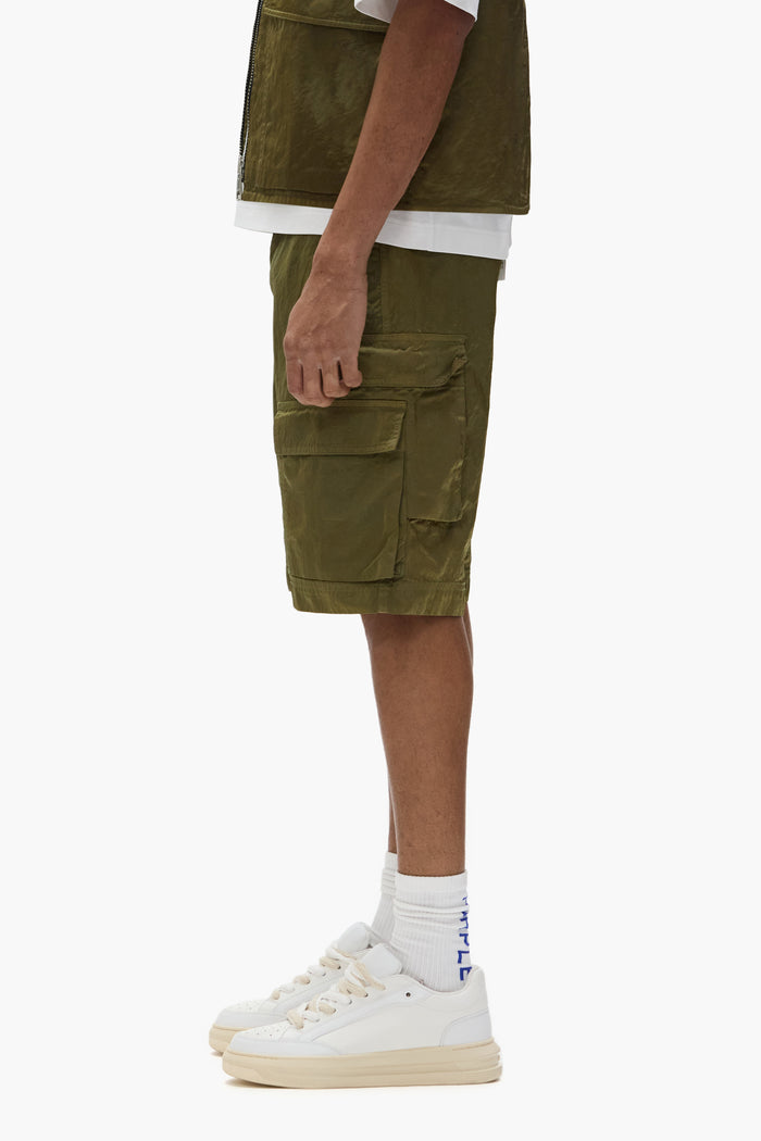 Cargo shorts in green sateen fabric with belt loops and utility flap pockets.