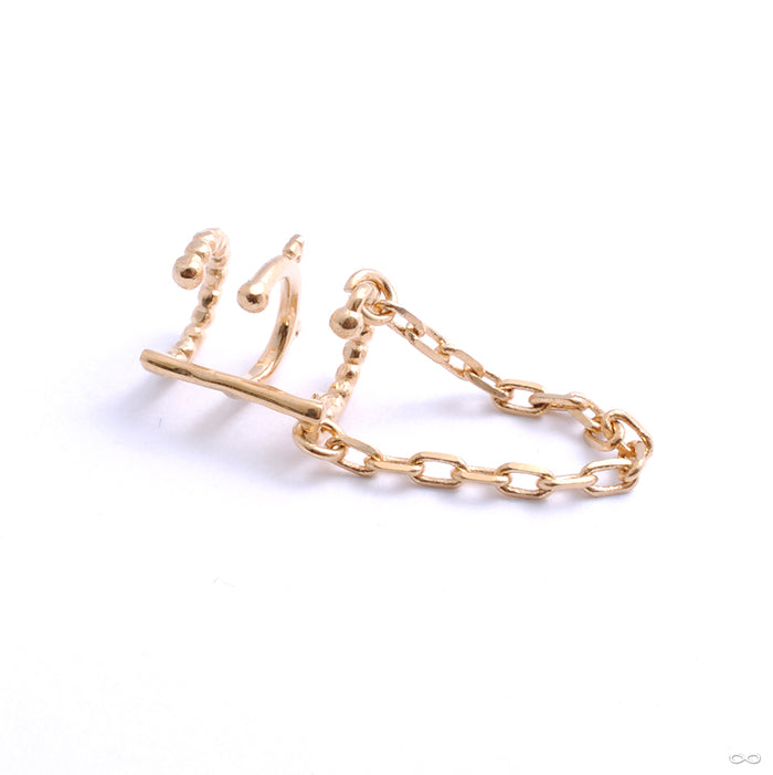 Chained Love Cuff from Tawapa in yellow gold left ear