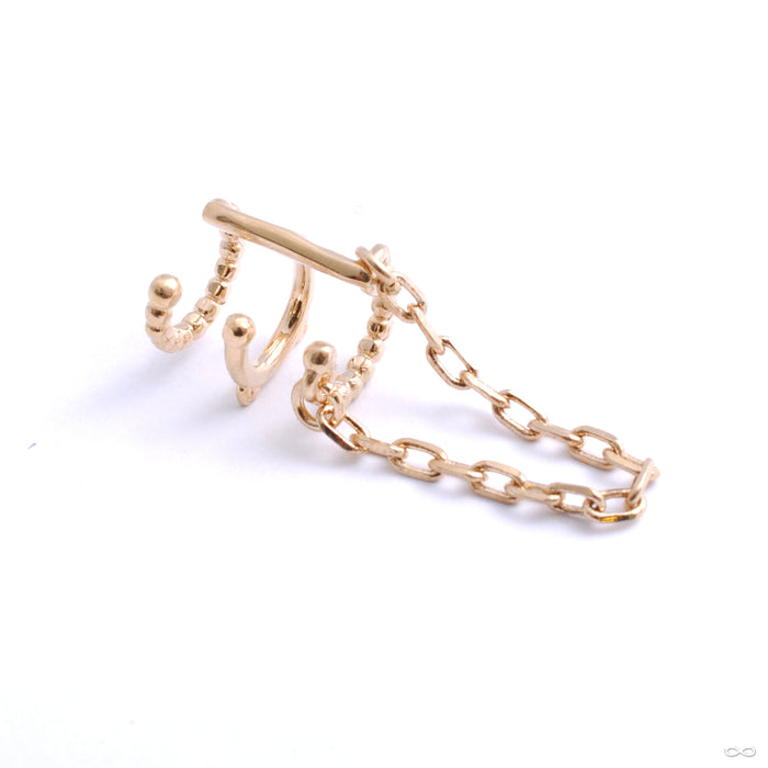 Chained Love Cuff from Tawapa in yellow gold right ear