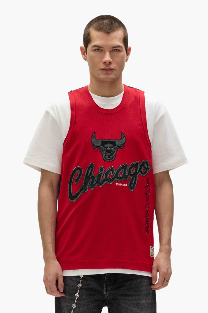 Chicago Bulls Mesh Jersey by Mitchell & Ness, oversized fit, features embroidered graphics.