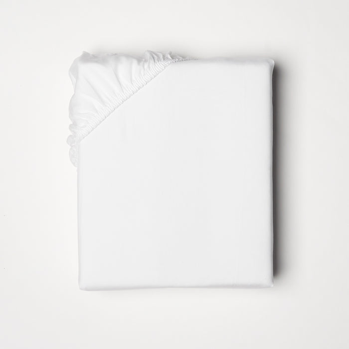 Fitted sheet offered in classic ivory and white, fits mattresses up to 18" deep with a fitted elastic skirt