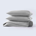 Stacked gray cooling pillow shams with soft cooling comforter