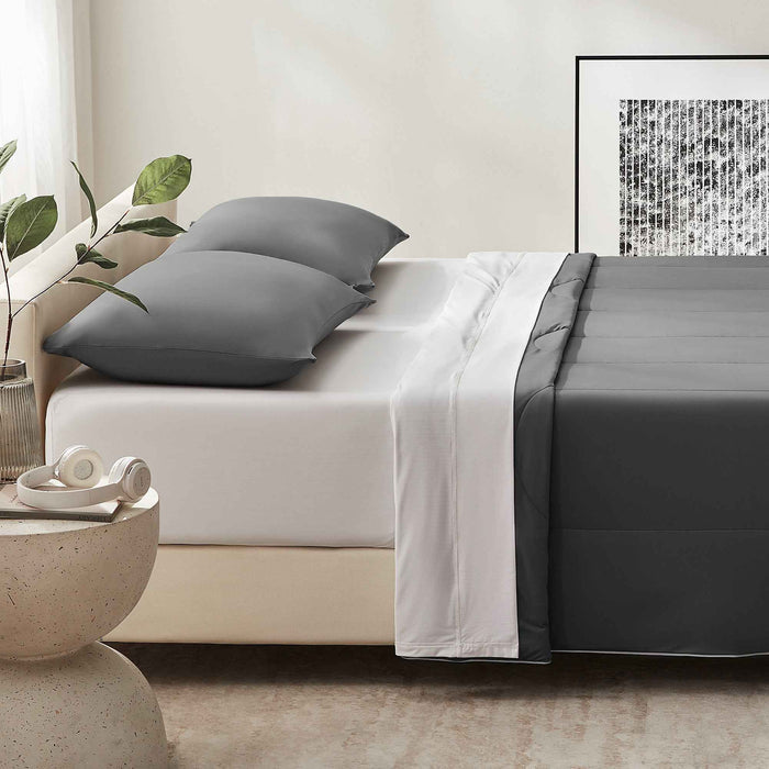 Dark gray cooling pillow shams paired with coordinated gray cooling comfoter and white cooling sheet