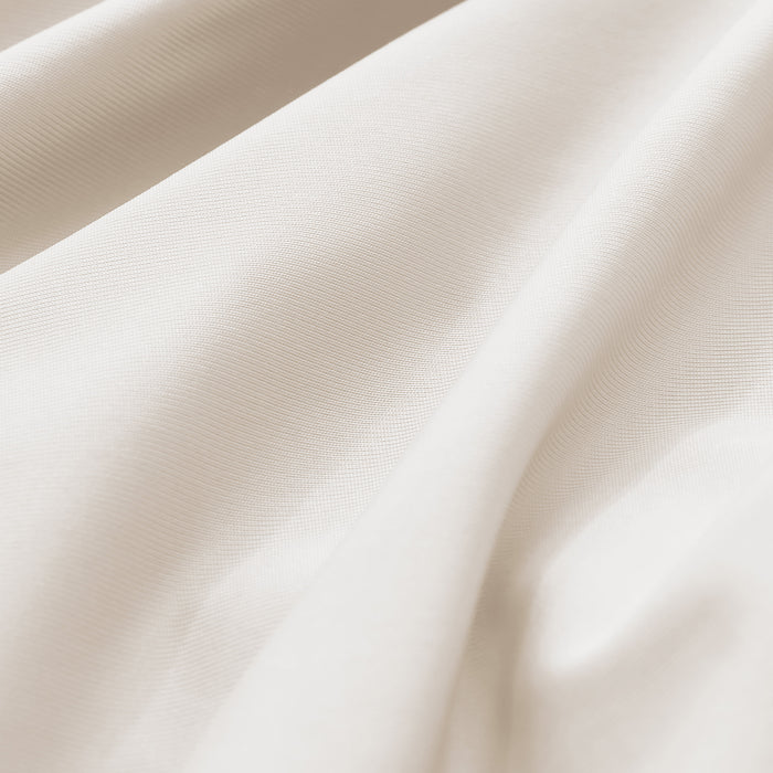 Close-up of smooth beige cooling pillowcase fabric