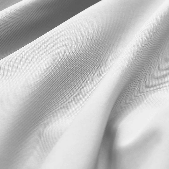Close-up of smooth light gray cooling pillowcase fabric