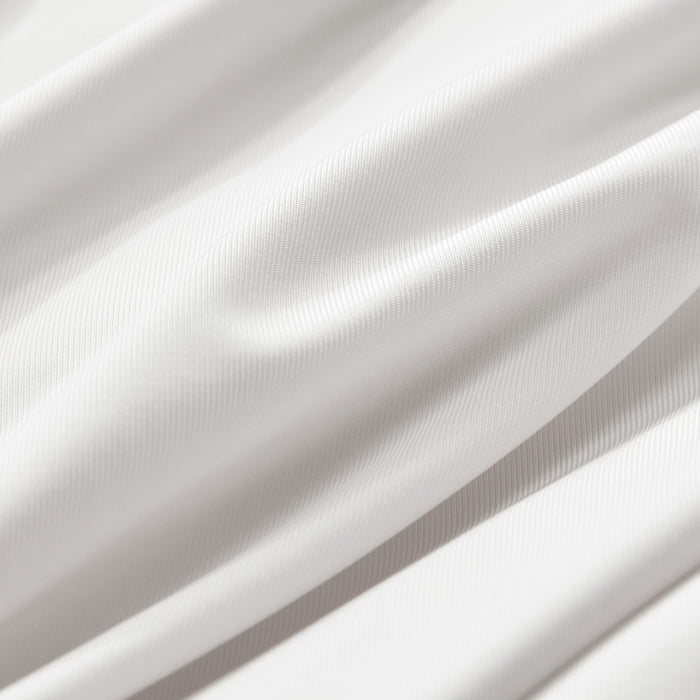 Close-up of smooth white cooling pillowcase fabric