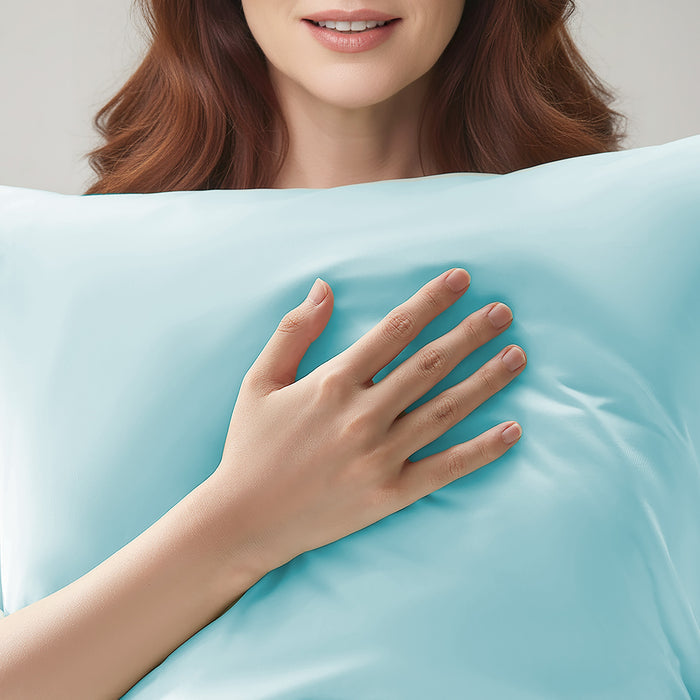 Woman resting on a blue cooling pillowcase for comfortable sleep