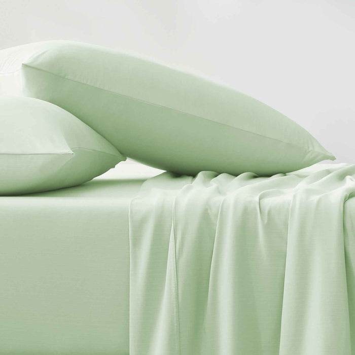 Green cooling pillows and sheets with a smooth cool-to-the-touch finish
