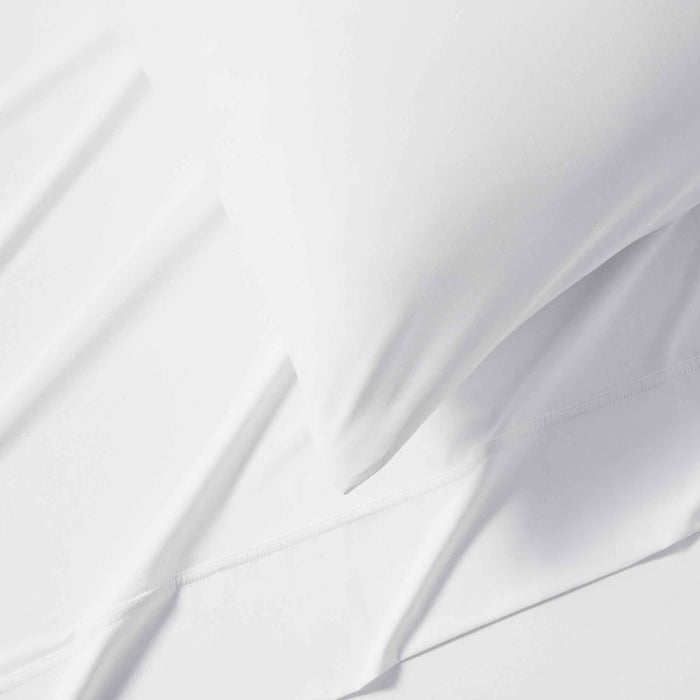 Close-up of white cooling sheet fabric with breathable temperature-regulating layers