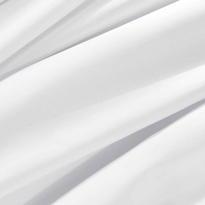 Close-up of silky white cooling sheet fabric with moisture-wicking performance