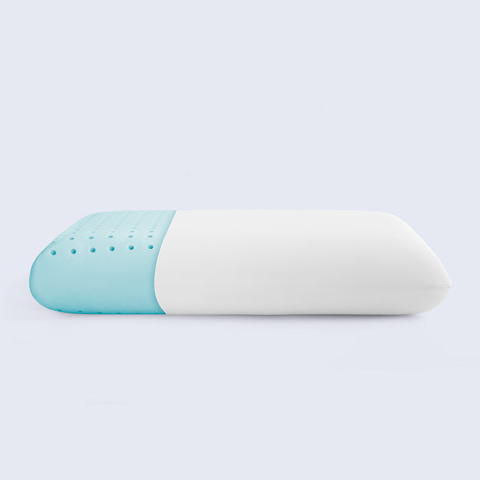 Two-toned blue and white pillow on a light gray background, featuring breathable layers