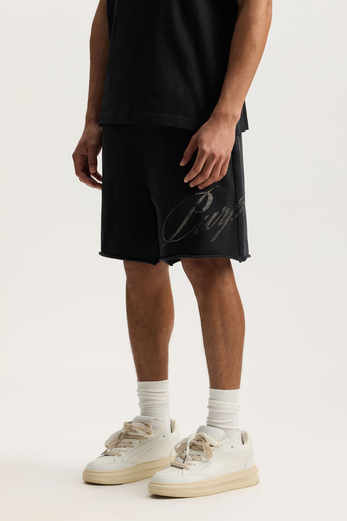 Crystal Slanted Script Short with mid acid wash, elastic waistband, and hand pockets.