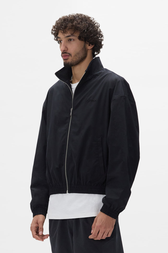 Crystal Wordmark Track Jacket with front zipper, relaxed fit, and fine rock crystals.