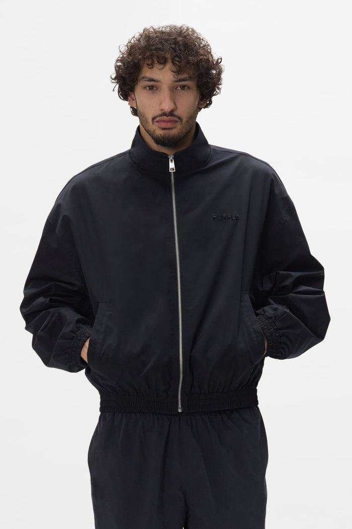 Crystal Wordmark Track Jacket in relaxed fit with front zipper and fine rock crystals