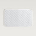 Delfine Bath Mat in the color white #color_white
