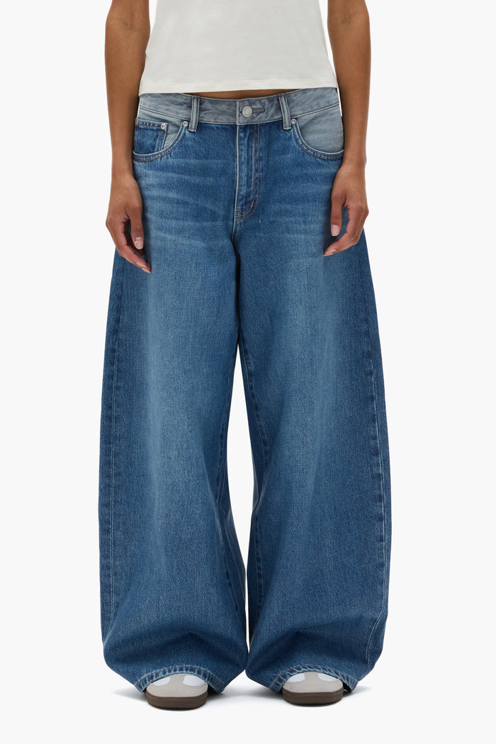 Dual Tone Baggy Denim in light indigo with low rise and 5 pocket style, available in multiple sizes.