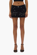 Embellished Mini Skirt with beaded embellishment and front zipper fly in flocked fabric.