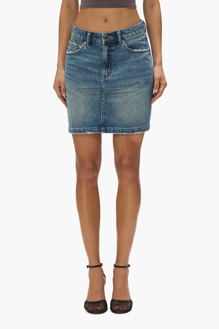 Embossed Monogram Mini Skirt with high rise, relaxed fit, and 5 pocket styling in cotton.