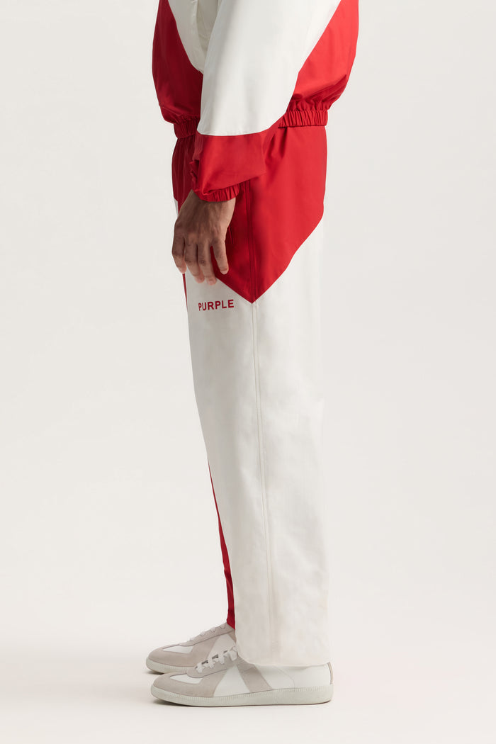 England All Around Pant in relaxed fit with elasticated cuff and welt zipper pocket