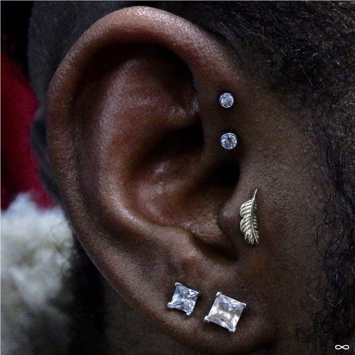 Tragus piercing with Feather Press-fit End in Gold from BVLA in 14k White Gold