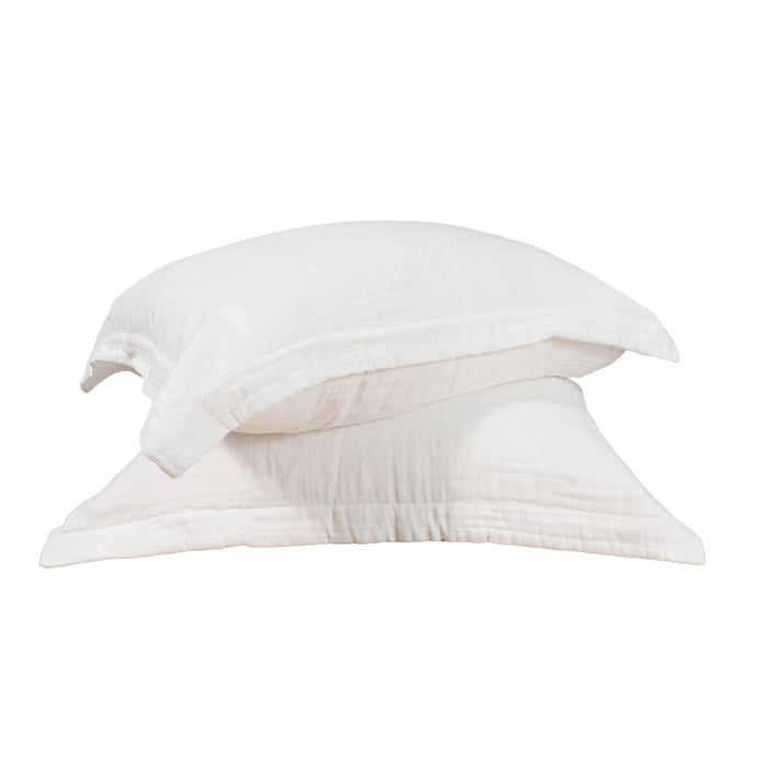 Two muslin pillow shams against a white background. #color_arctic snow