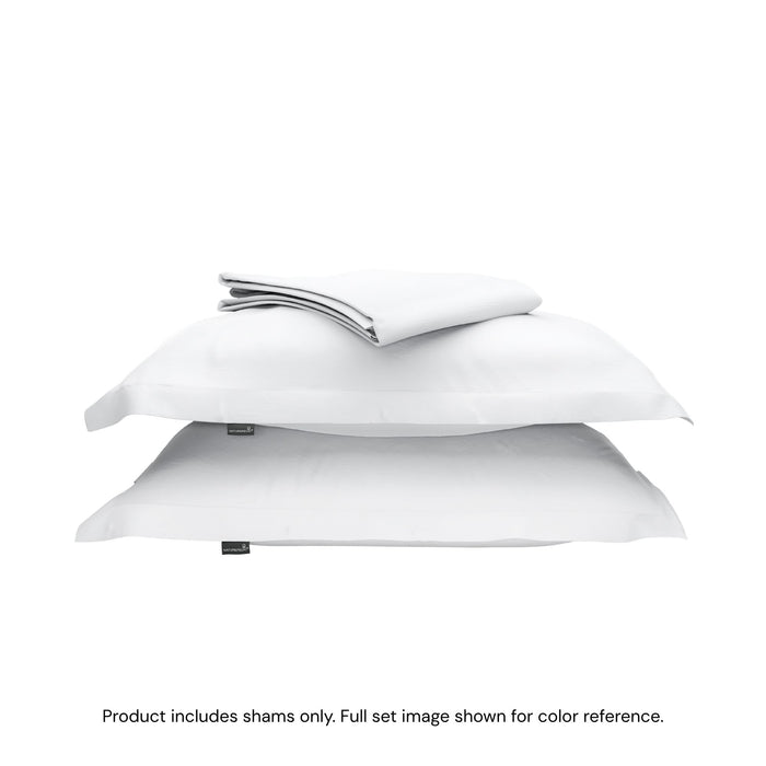 A duvet cover folded on top of two pillow shams #color_arctic snow