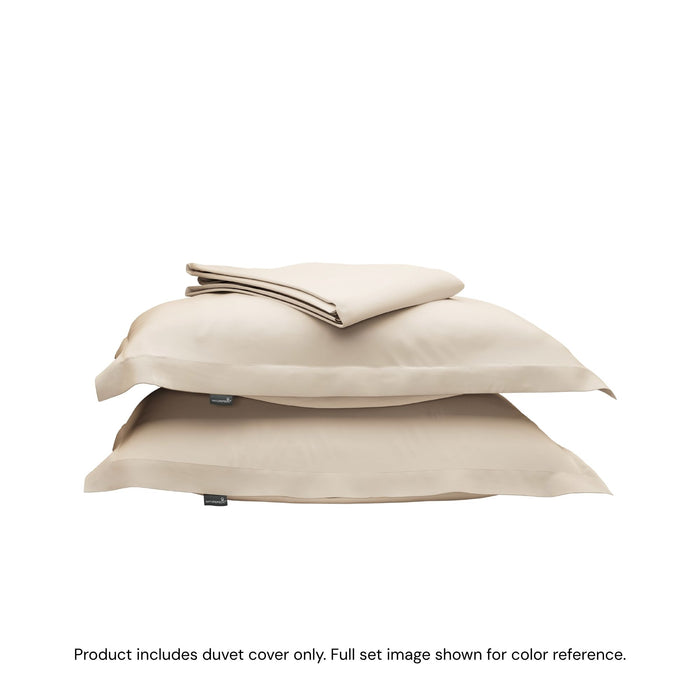 A folded duvet cover sitting on top of two pillow shams #color_undyed