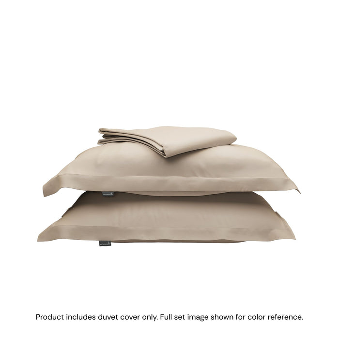 A folded duvet cover sitting on top of two pillow shams #color_sand