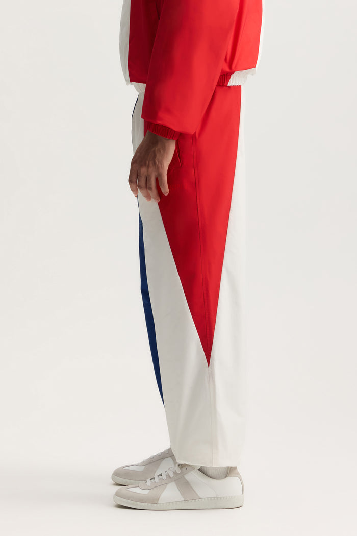France All Around Pant with relaxed fit, elasticated cuff, and welt zipper pocket.