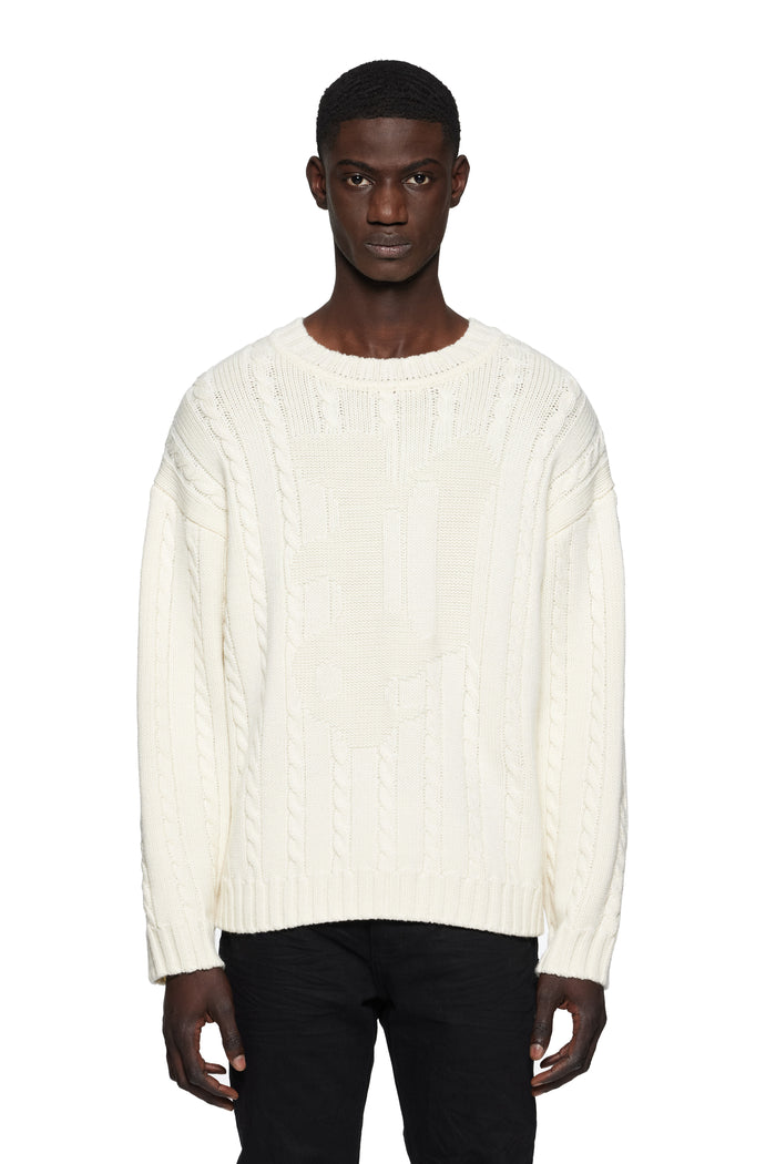 Gothic P Cable Knit Sweater in white with crewneck and rolled edges, made from merino wool.