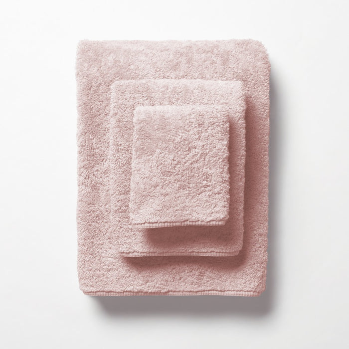 scandia home's indulgence wash, hand, and bath towel folded in the color blossom  #color_blossom