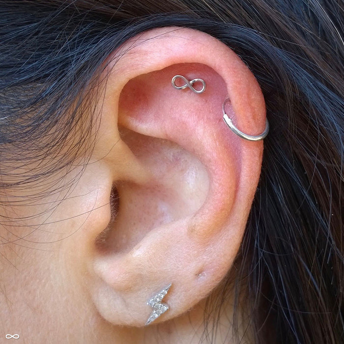 Outer helix piercing with Infinity Press-fit End in Gold from BVLA in 14k White Gold